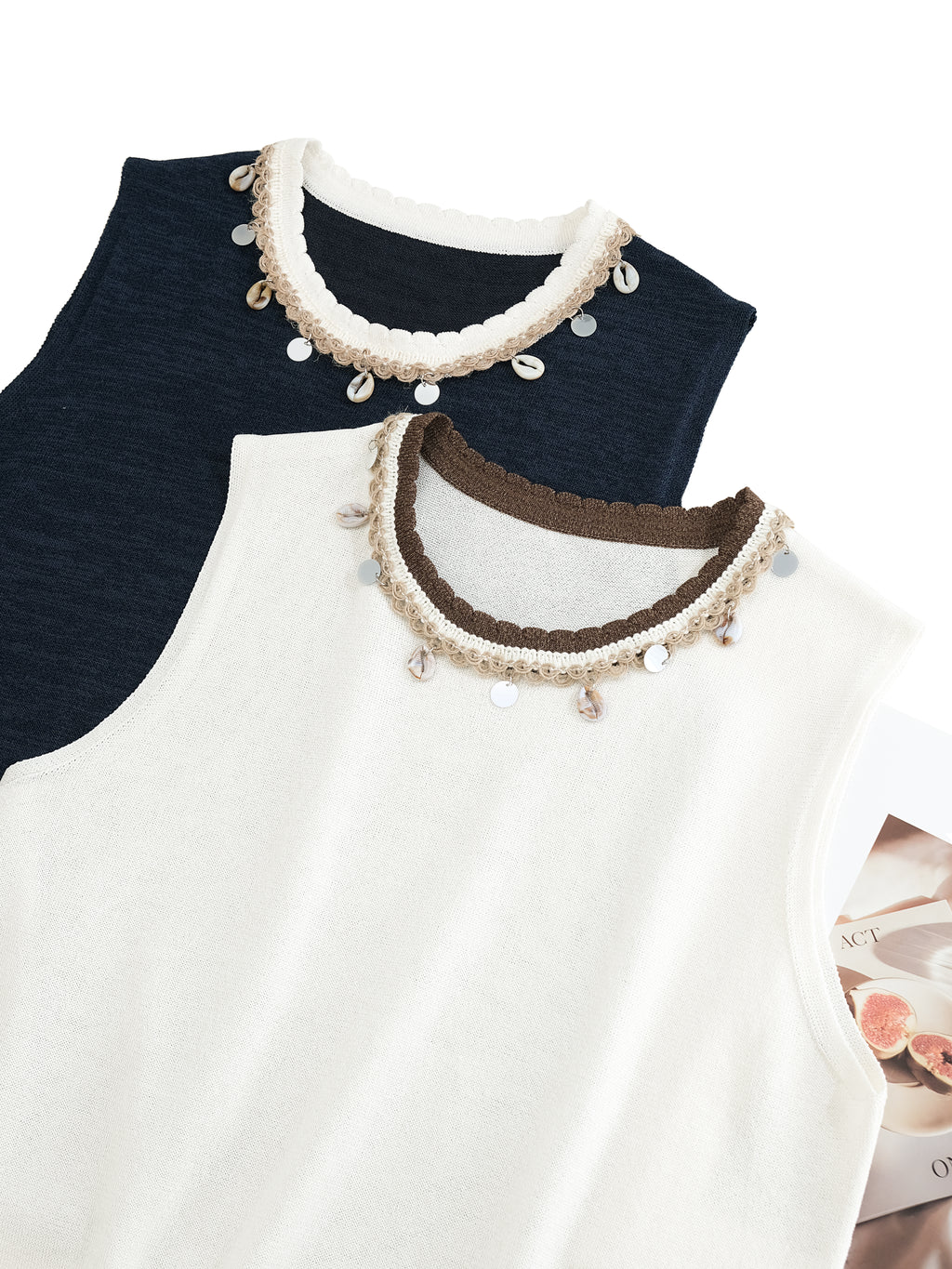 Two tops with decorative collars in navy and white on a white background