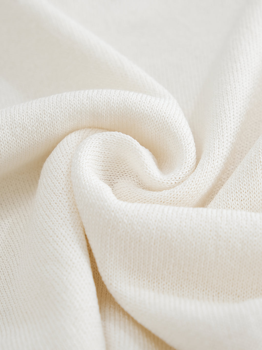 Close-up of white fabric with soft texture