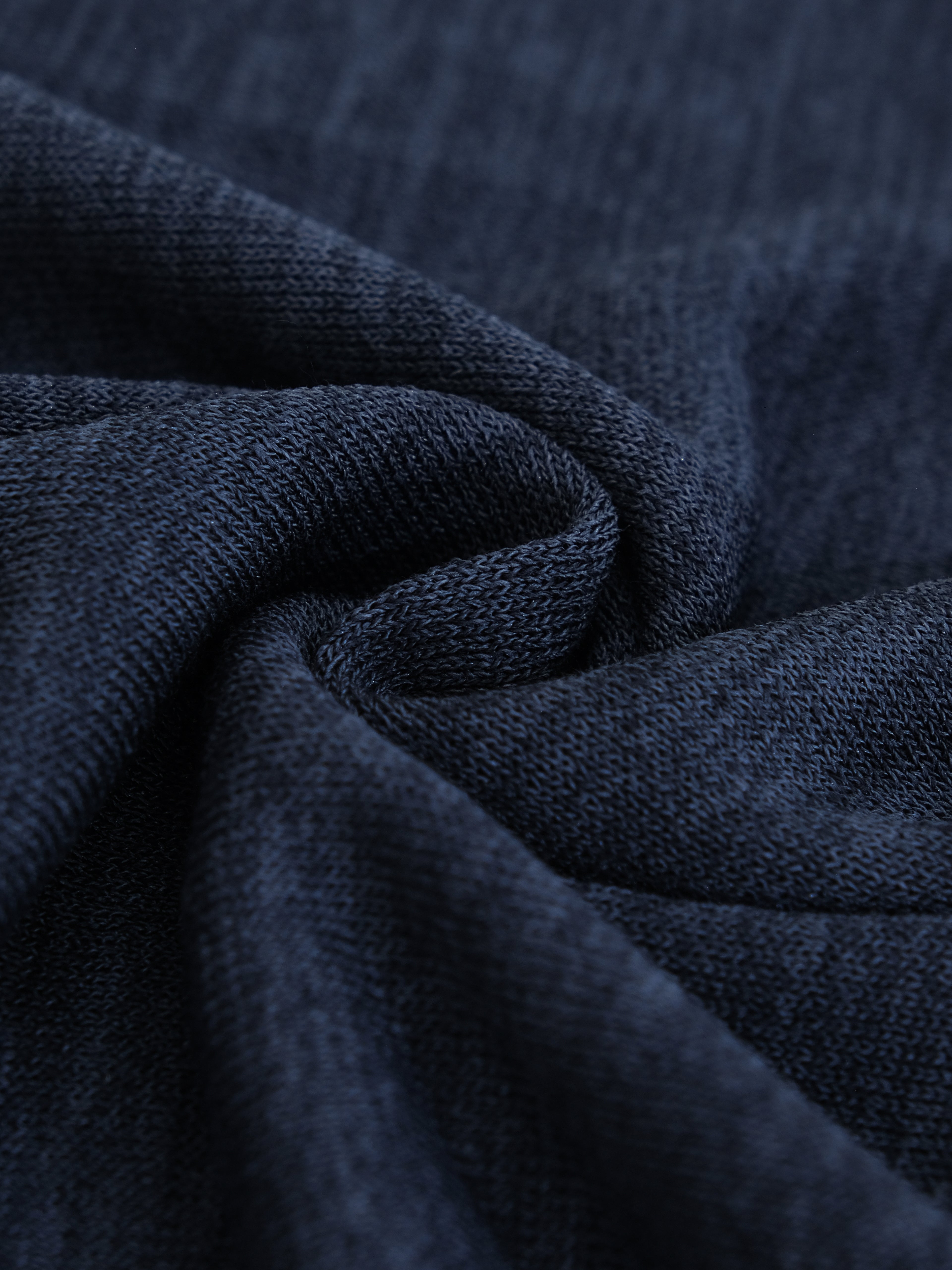 Close-up of dark blue fabric with visible texture